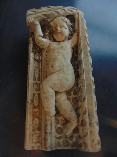 null Pair of decorative elements in pendants decorated with putti supporting a drapery,...