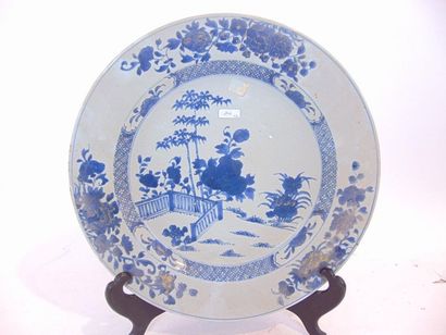 CHINE Two dishes decorated in blue and white (the first enhanced with gold), Indian...