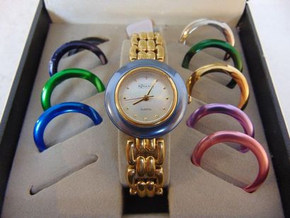 RODANIA Ladies' gold-plated metal wristwatch with interchangeable anodized bezels,...