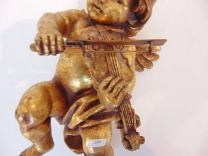 null Musical angel, 20th, subject in composition with a golden patina, h. 37 cm.