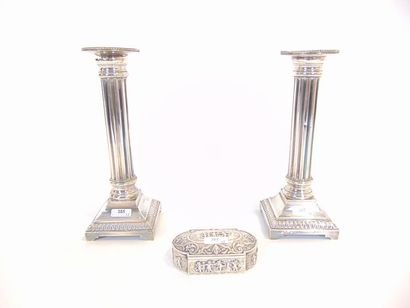 null Pair of torches in column, 20th century, silver plated metal, h. 23 cm; a snuff...