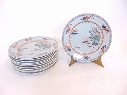 CHINE Suite of twelve plates with Imari decoration of a lake landscape, Indian Companies,...