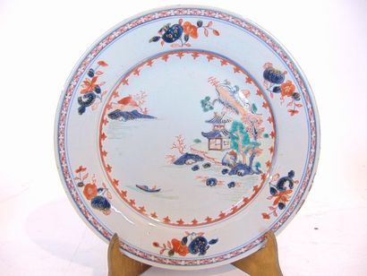 CHINE Suite of twelve plates with Imari decoration of a lake landscape, Indian Companies,...