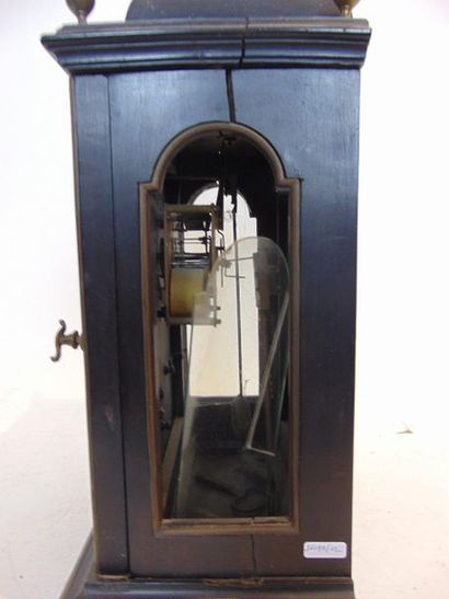null A late 19th century blackened wood clock with brass rods and bronze ornaments,...