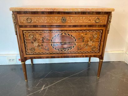 null Louis XVI style chest of drawers opening by three drawers (one in the belt),...