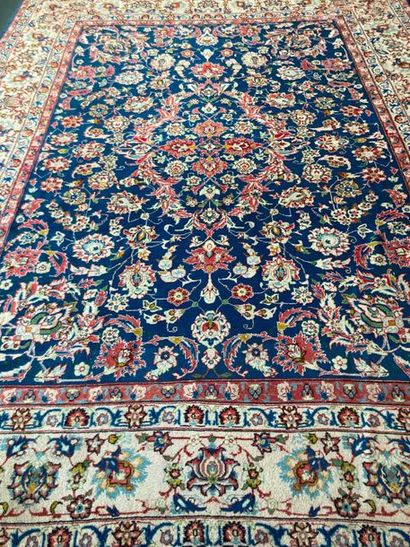 null Large Keshan style Persian carpet with floral scrolls on indigo field, 392x293...