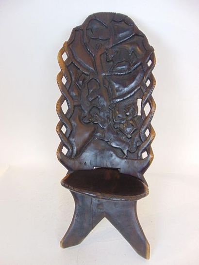 null African carved wooden seat, h. 96 cm.