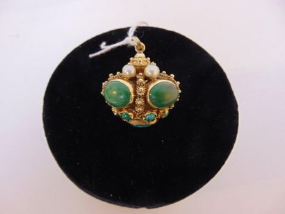 null 18 karat yellow gold ovoid pendant set with cabochons (jasper and turquoise)...