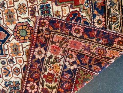 null Nahavand style Persian carpet with central medallion and polychrome stylized...