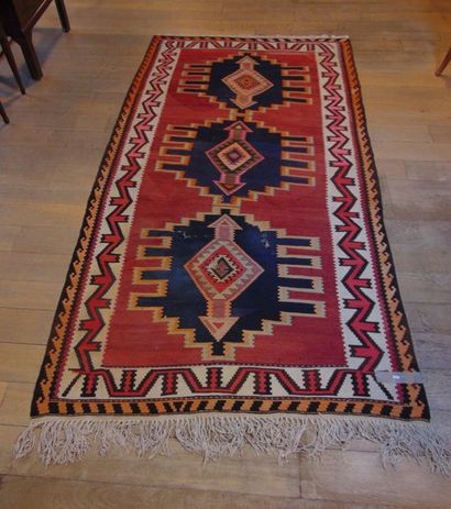 null Large kilim with triple medallion on madder field, 312x159 cm approx. [alterations...
