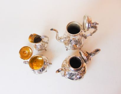 null Quadripod tea service in the Rocaille style, late 19th century, chased silver...