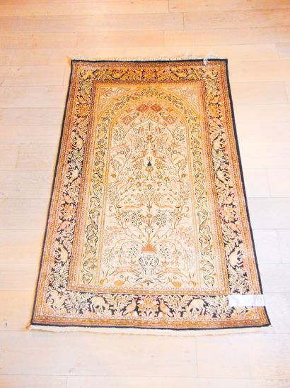 null Persian mihrab prayer rug decorated with a flowery vase and various animal figures,...