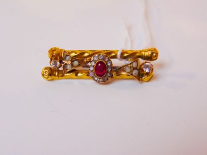 null Yellow gold (14 carats) barrette set with gems, l. 3.5 cm, 2 g approx. alte...