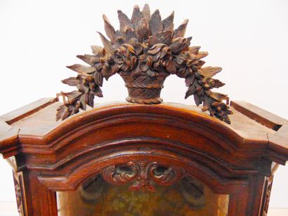 null A small sconce window with cut sides opening by a leaf, decorated with a flowery...