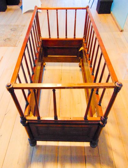 null A Louis-Philippe period child's bed, circa 1840, wood and mahogany veneer, 102x143,5x71,5...
