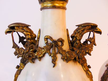 null A pair of Louis XVI style cassolettes with eagle heads and festoons, late 19th...
