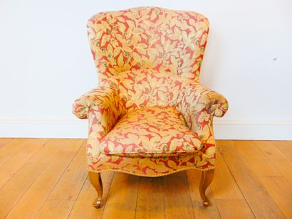 null A large Louis XV style winged armchair, 20th century, moulded and carved wood,...
