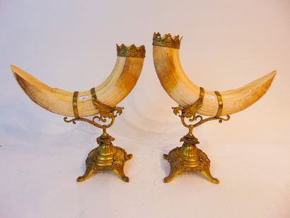 null A pair of Napoleon III period ceremonial drinking horns, shafts with winged...