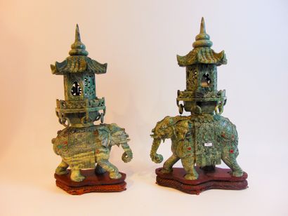 CHINE Fake pair of processional elephant incense burners supporting a pagoda (one...