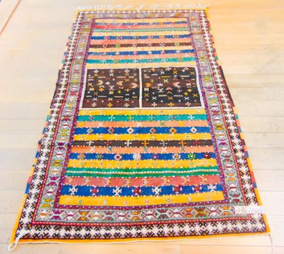 null Berber carpet with stripes and polychrome stylized motifs, 262x151 cm approx....