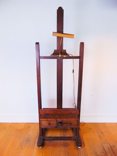 null A large workshop easel with crank handle and two drawers, late 19th century,...