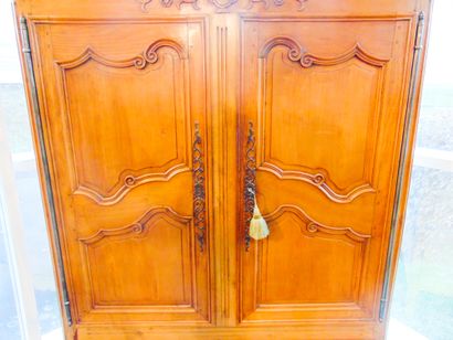 null A Louis XV style Provencal cupboard opening with two leaves and two drawers,...