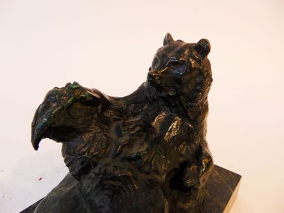 ECOLE FRANCAISE "Reclining Bear", 20th century, bronze proof with shaded patina,...