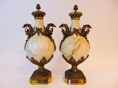 null A pair of Louis XVI style cassolettes with eagle heads and festoons, late 19th...