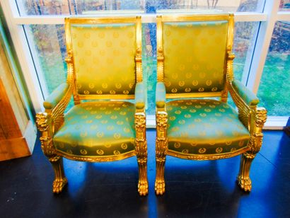 null A pair of Empire style ceremonial armchairs with winged lion protuberances,...