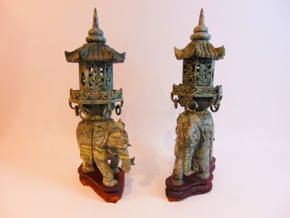 CHINE Fake pair of processional elephant incense burners supporting a pagoda (one...
