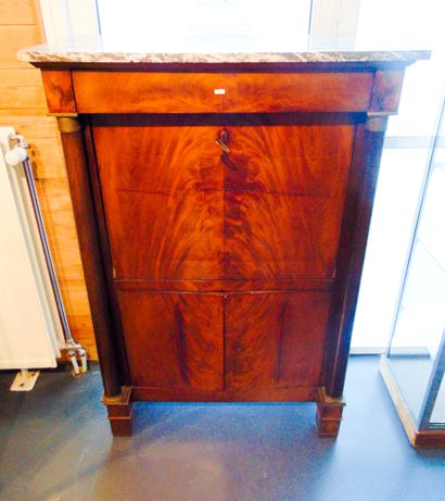 null An Empire period secretary cabinet opening with a flap, two leaves and a drawer,...