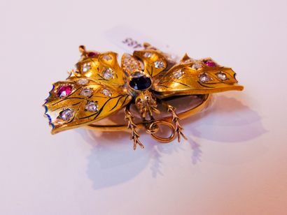 null Butterfly brooch in yellow gold (18 carats) with enamel and set with a sapphire...