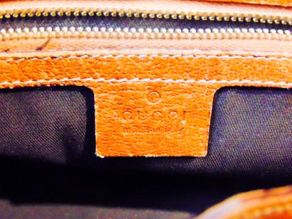 GUCCI Monogrammed canvas and leather handbag, l. 31 cm [slight alterations].
