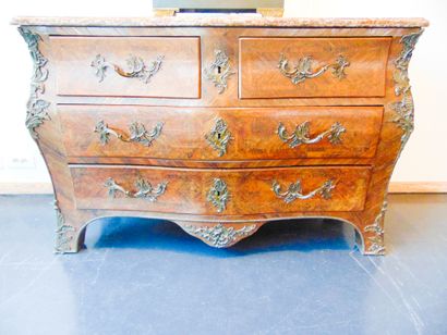 null A Louis XV style chest of drawers opening with four drawers on three rows, 19th...