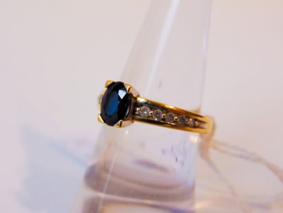 null Yellow gold ring (18 carats) set with an oval sapphire with small diamonds,...