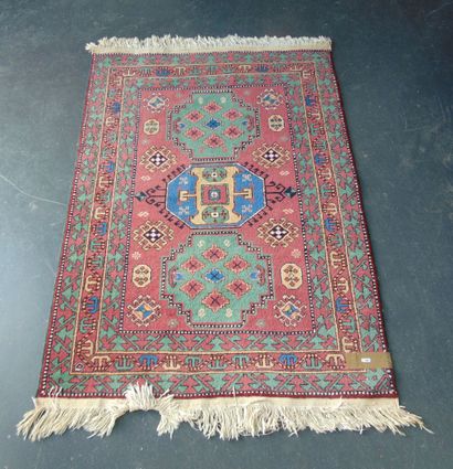 null Small Caucasian carpet in the Kazak style with polychrome geometric patterns...