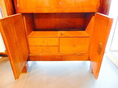 null An Empire period secretary cabinet opening with a flap, two leaves and a drawer,...