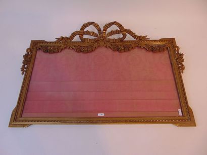 null A Louis XVI style photograph frame decorated with a large pleated bow and festoons,...