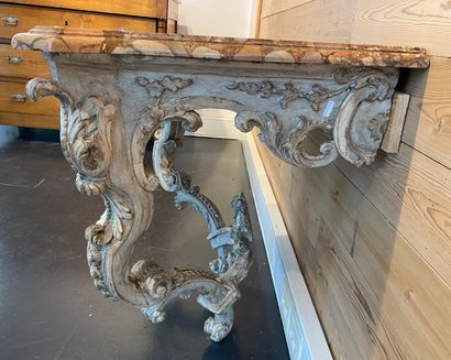 null A Louis XV period wall console, mid 18th century, carved and relacquered wood,...