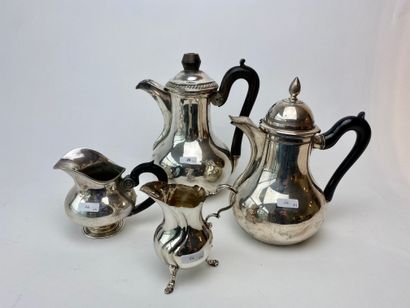 null Meeting of two silver and blackened wood coffee pots and two milk pots, hallmarks,...