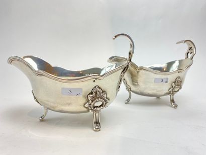 France Pair of Louis XV style tripod sauce boats, 1878-1973, silver chased (800 thousandths),...