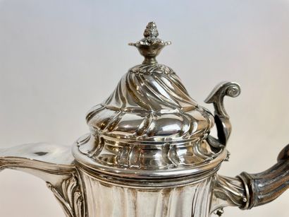 null A large tripod coffee pot in a baluster with torso ribs, Louis XV period, mid...
