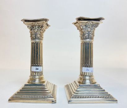 SHEFFIELD Pair of columnar torches with Corinthian capitals, 1912, silver embossed...