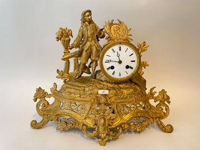 null Clock decorated with a figure of a painter in the round, late 19th century,...