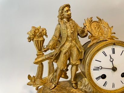 null Clock decorated with a figure of a painter in the round, late 19th century,...