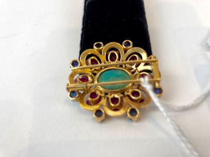 null Oval brooch in yellow gold (18 carats) set with a turquoise cabochon, engraved...