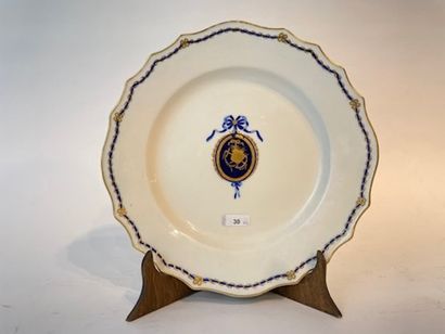 TOURNAI Two curved plates with neoclassical medallion decoration in blue and gold,...
