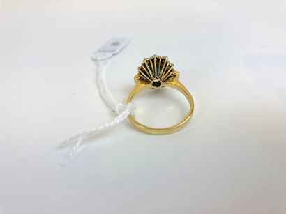 null Yellow gold (18K) daisy ring set with an oval sapphire and two baguette-cut...