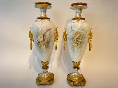 PARIS A pair of Napoleon III period spindle-shaped vases with polychrome and burnished...