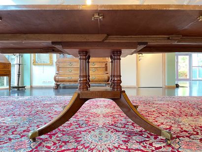 null English round table with four-legged base on casters, 20th century, veneer,...
